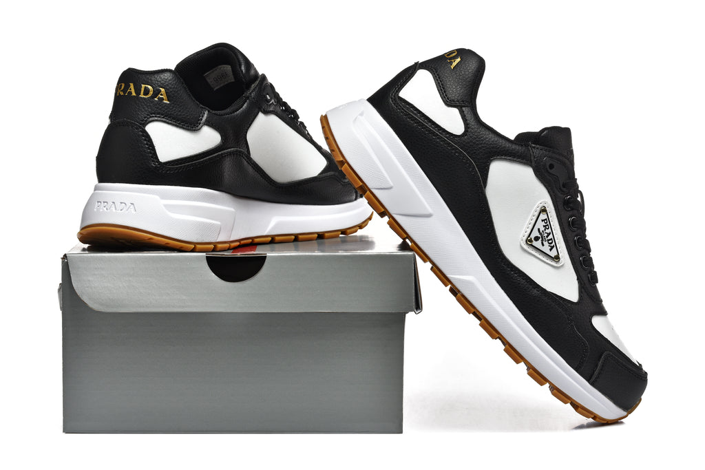 Prada Perforated-Toe Sneakers – Black, White & Gum